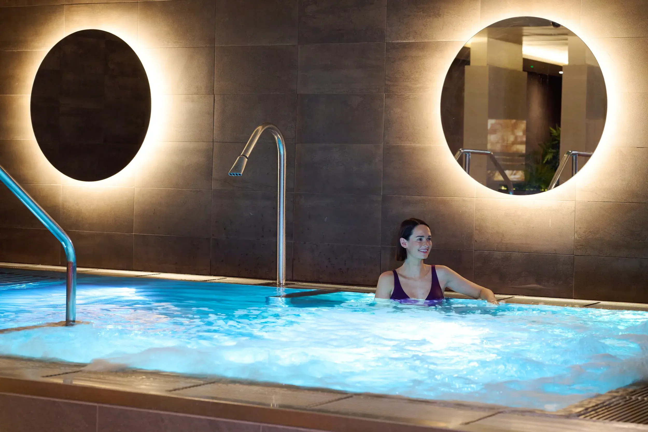 A woman relaxing in the hydro pool