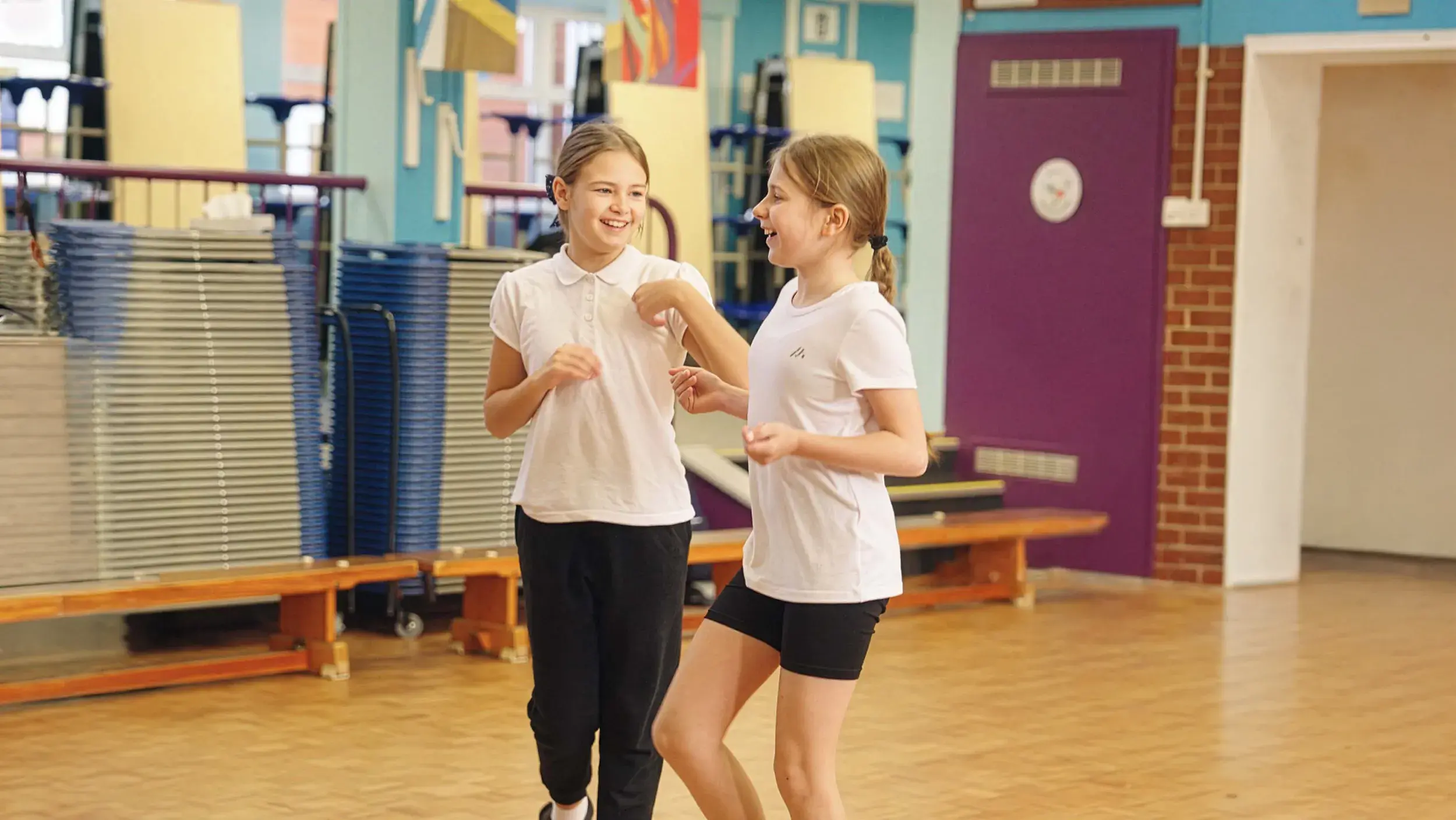 Two girls enjoying a dance class
