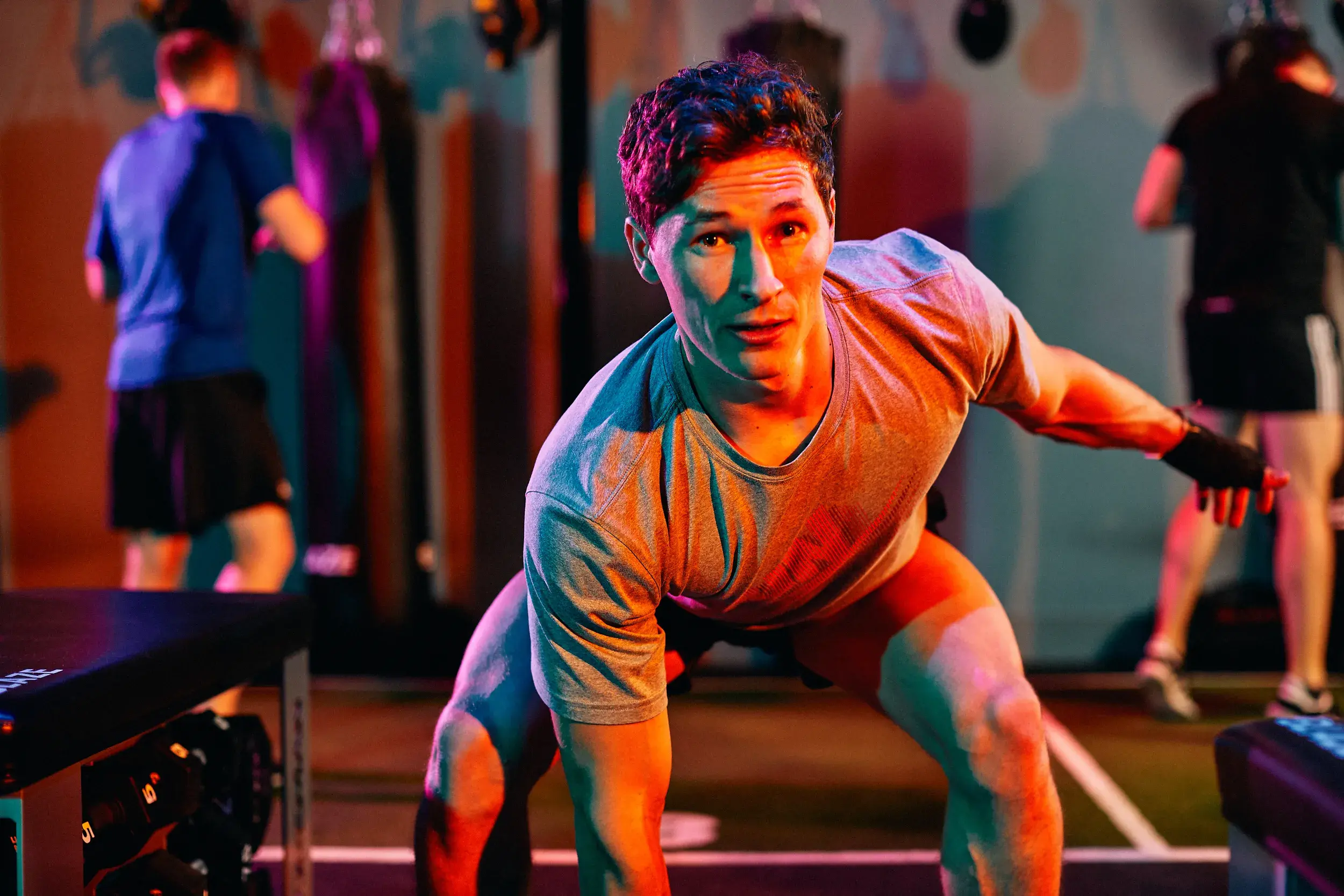 A teenage boy working out in a Blaze rebels class