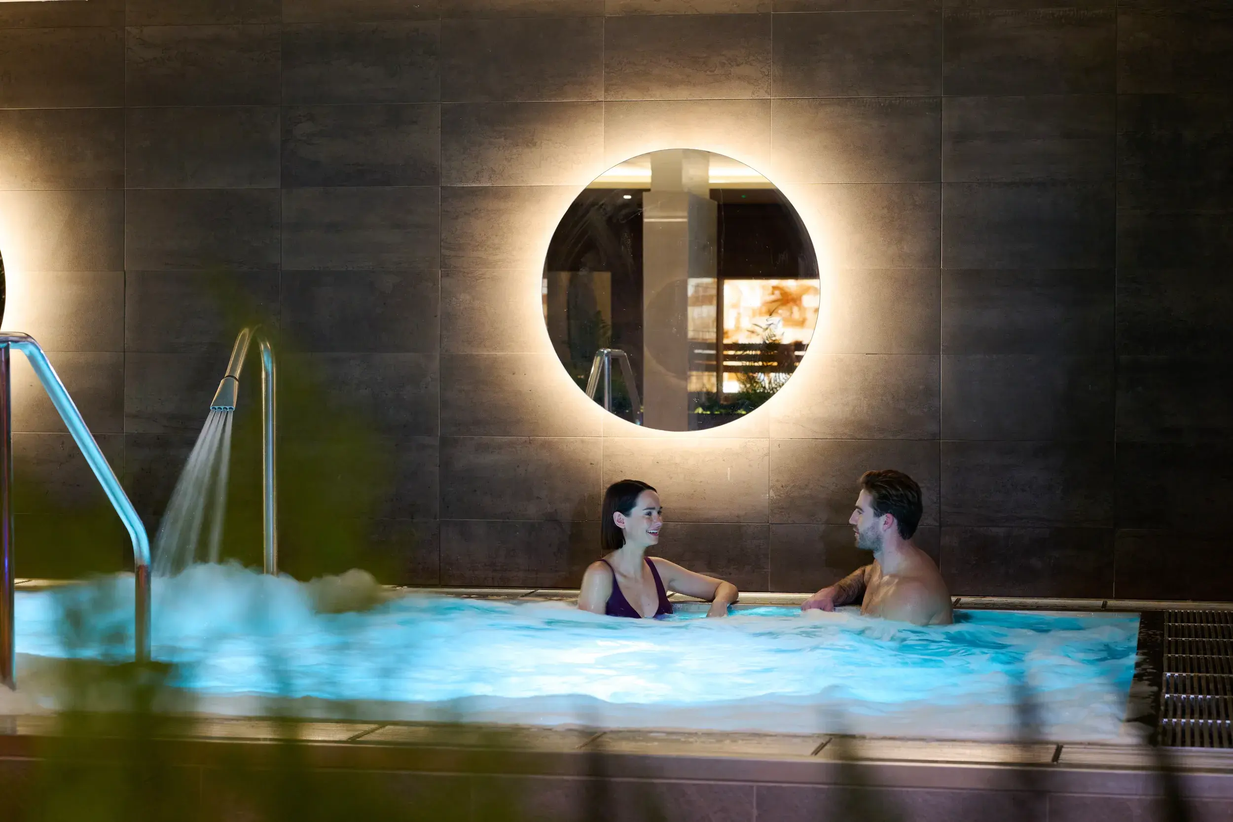 A couple relaxing in the hydro pool