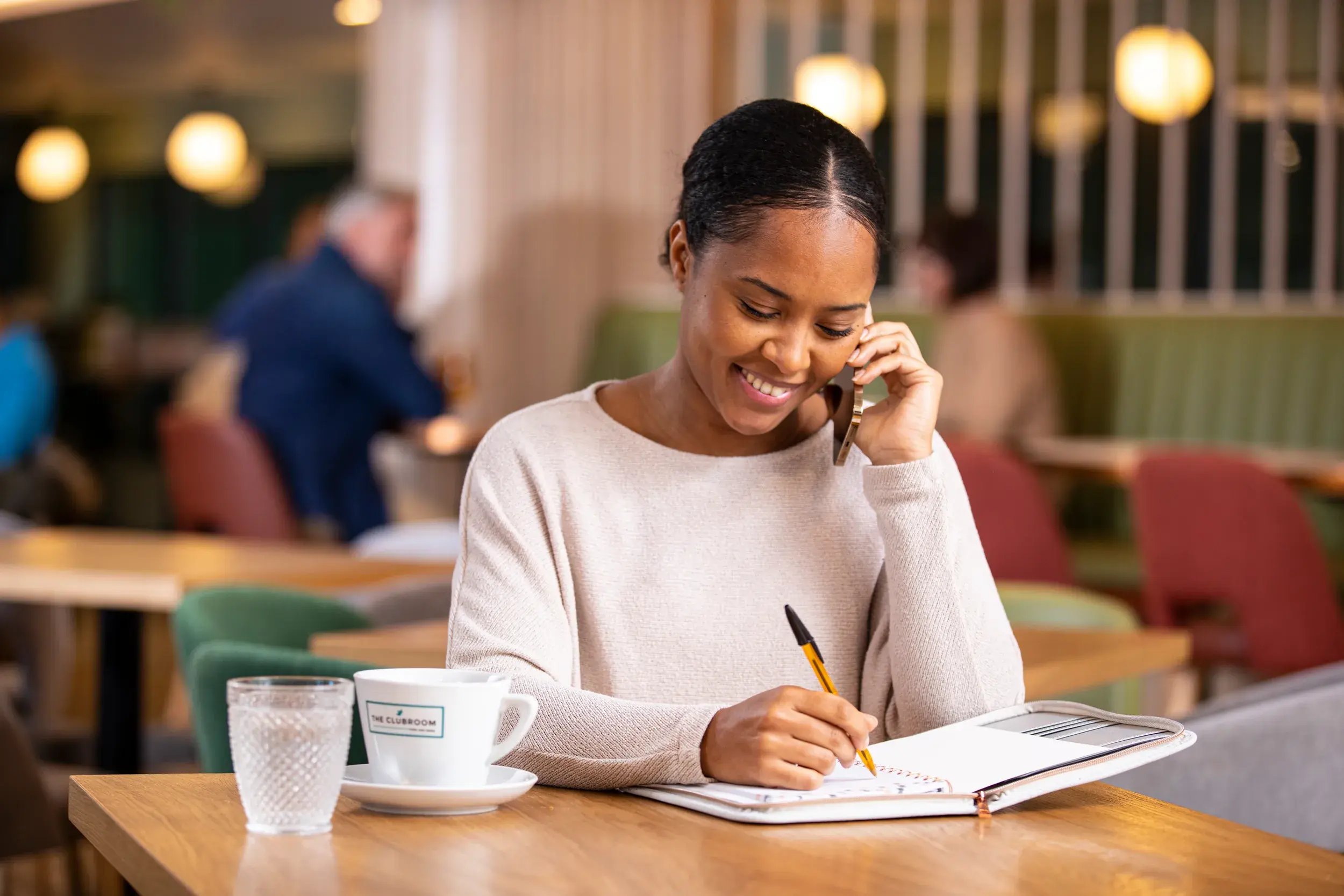 Woman working in a David Lloyd Clubs clubroom.