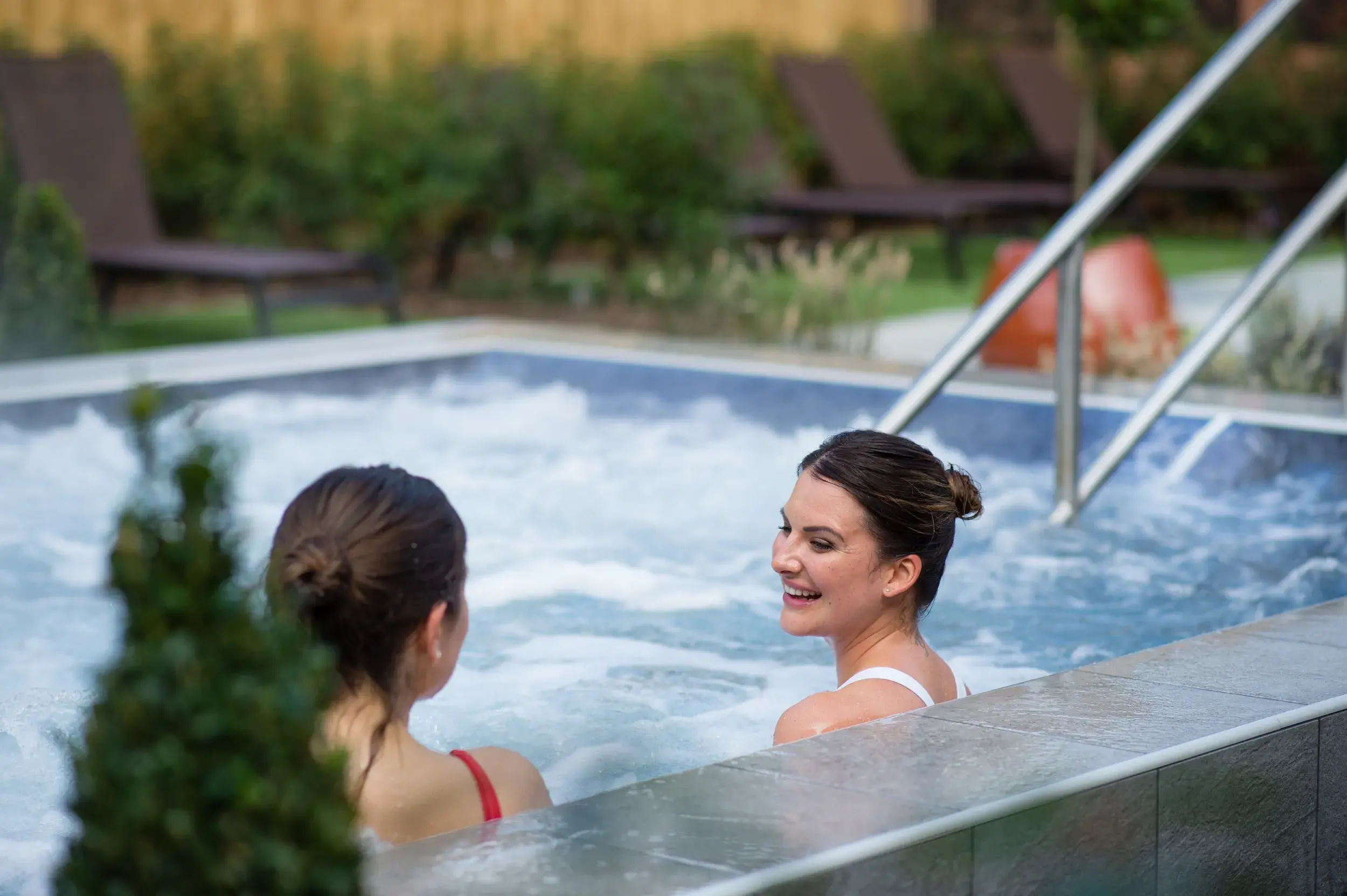 Seating and a plunge pool in the Spa Garden