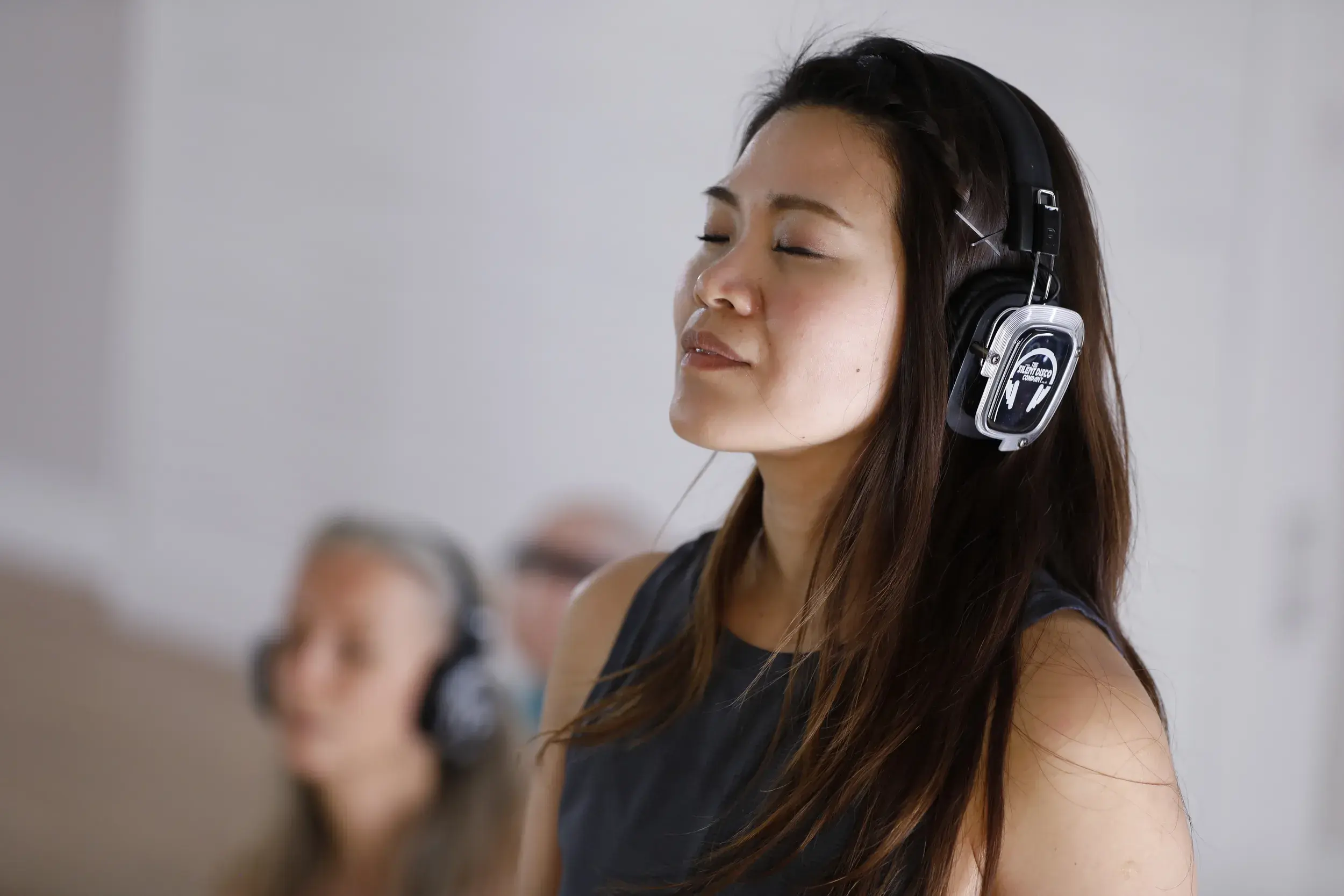 A father and son pushing a sled in a battlebox class