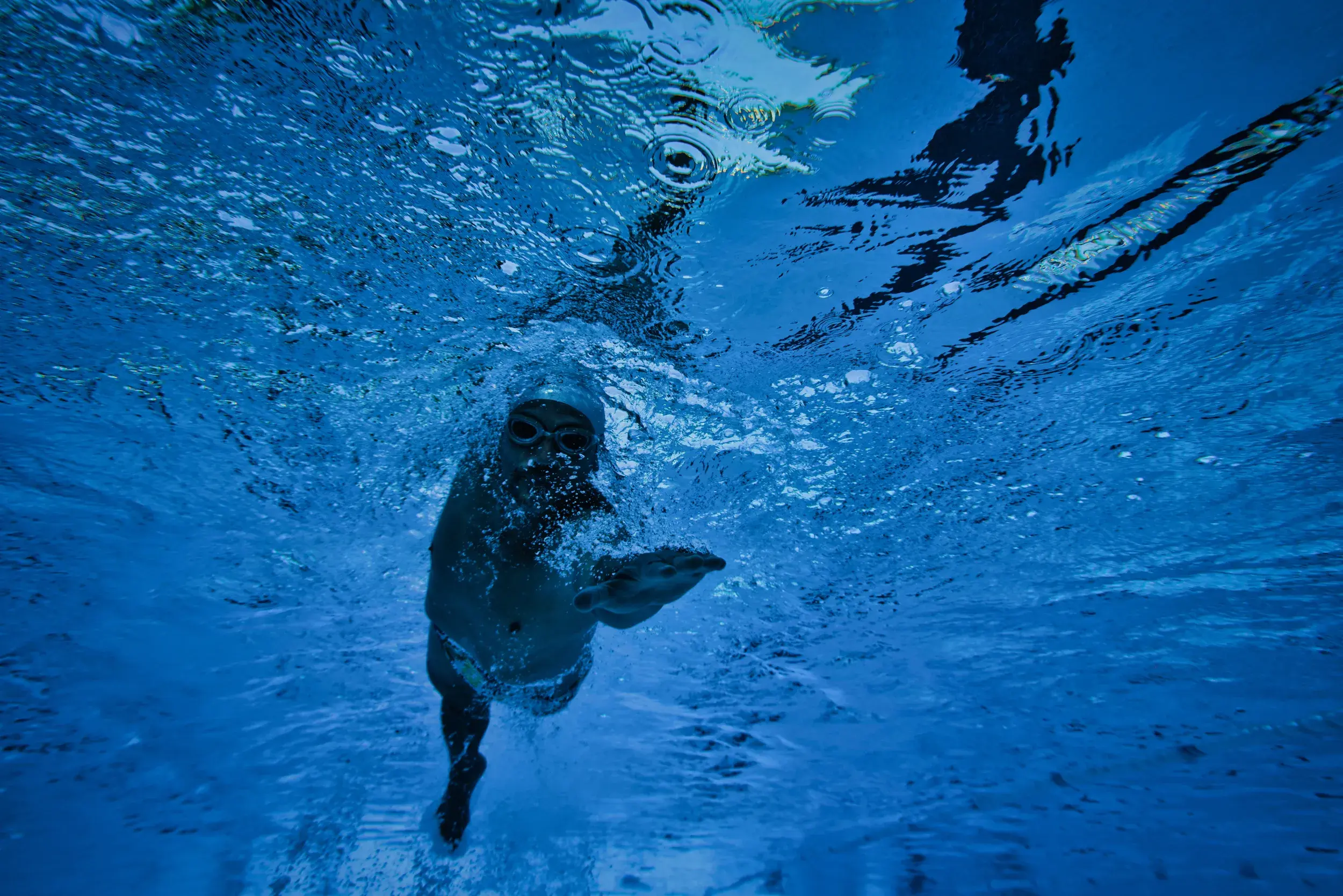 A man swimming front crawl
