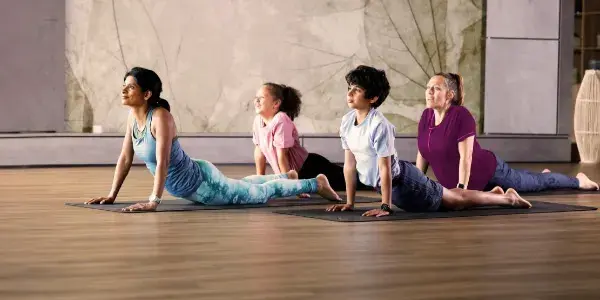 A group of kids stretching in a Spirit Rebels class