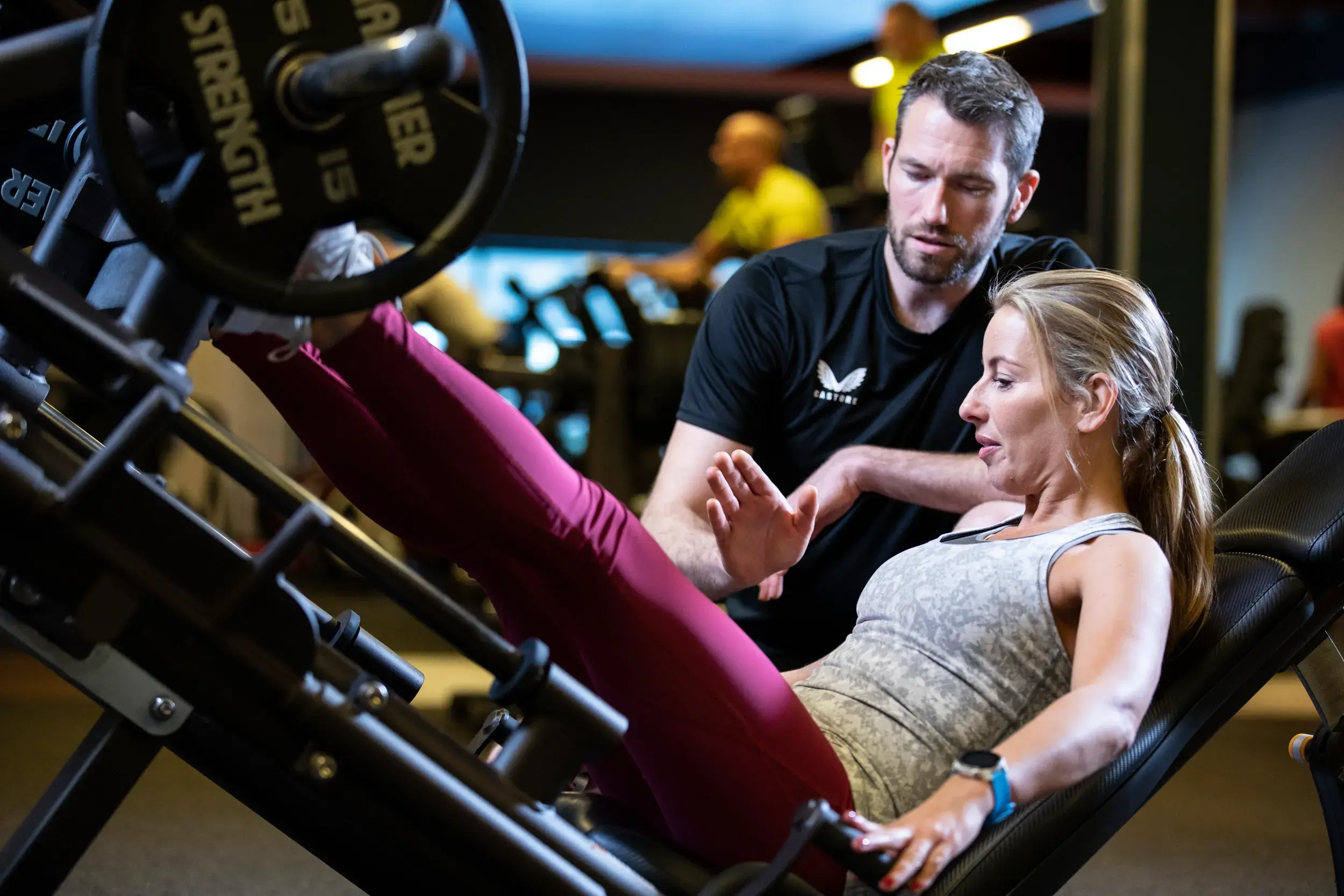 A woman working out with a personal trainer