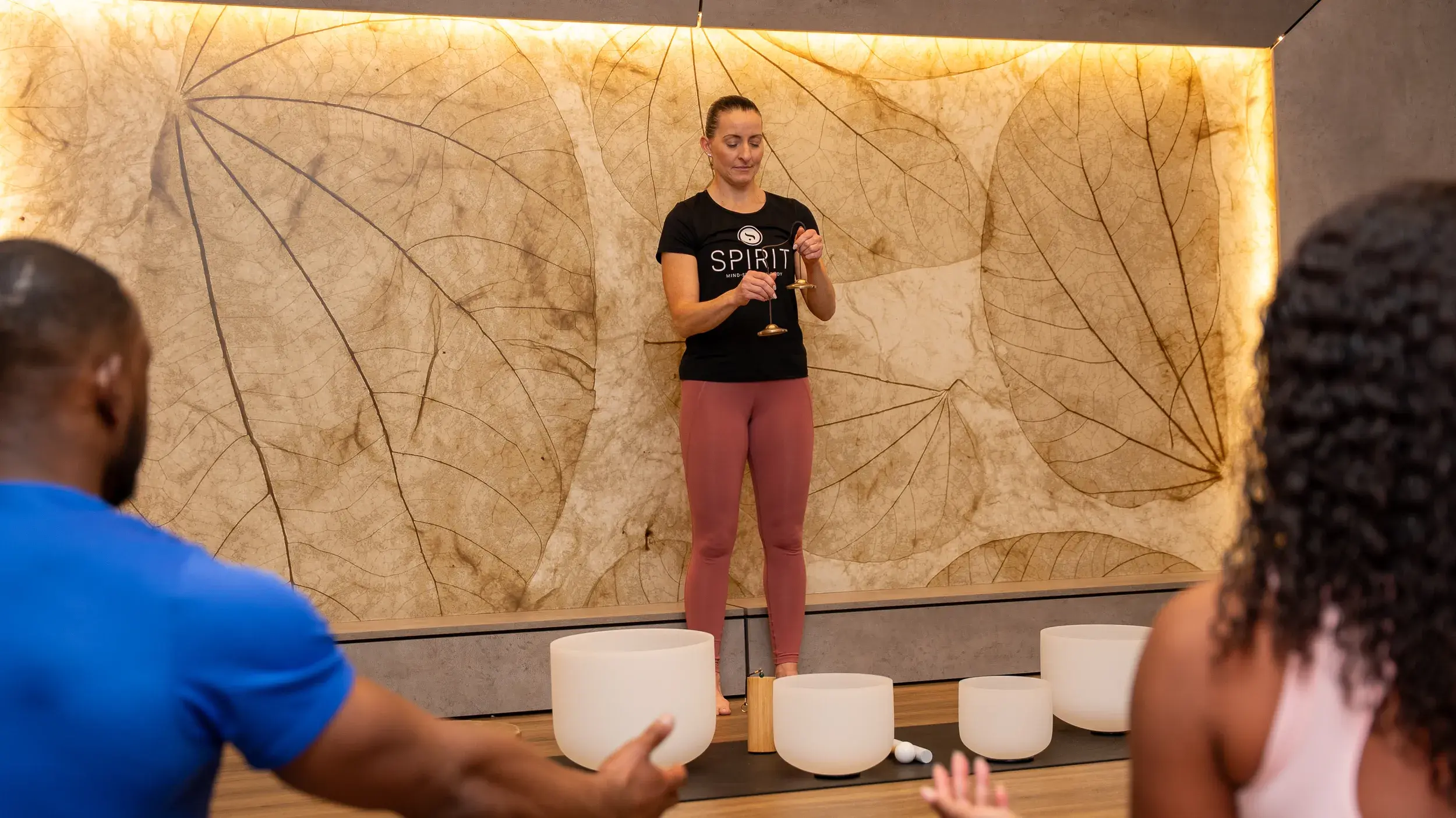 An instructor leading a Spirit sound bath class
