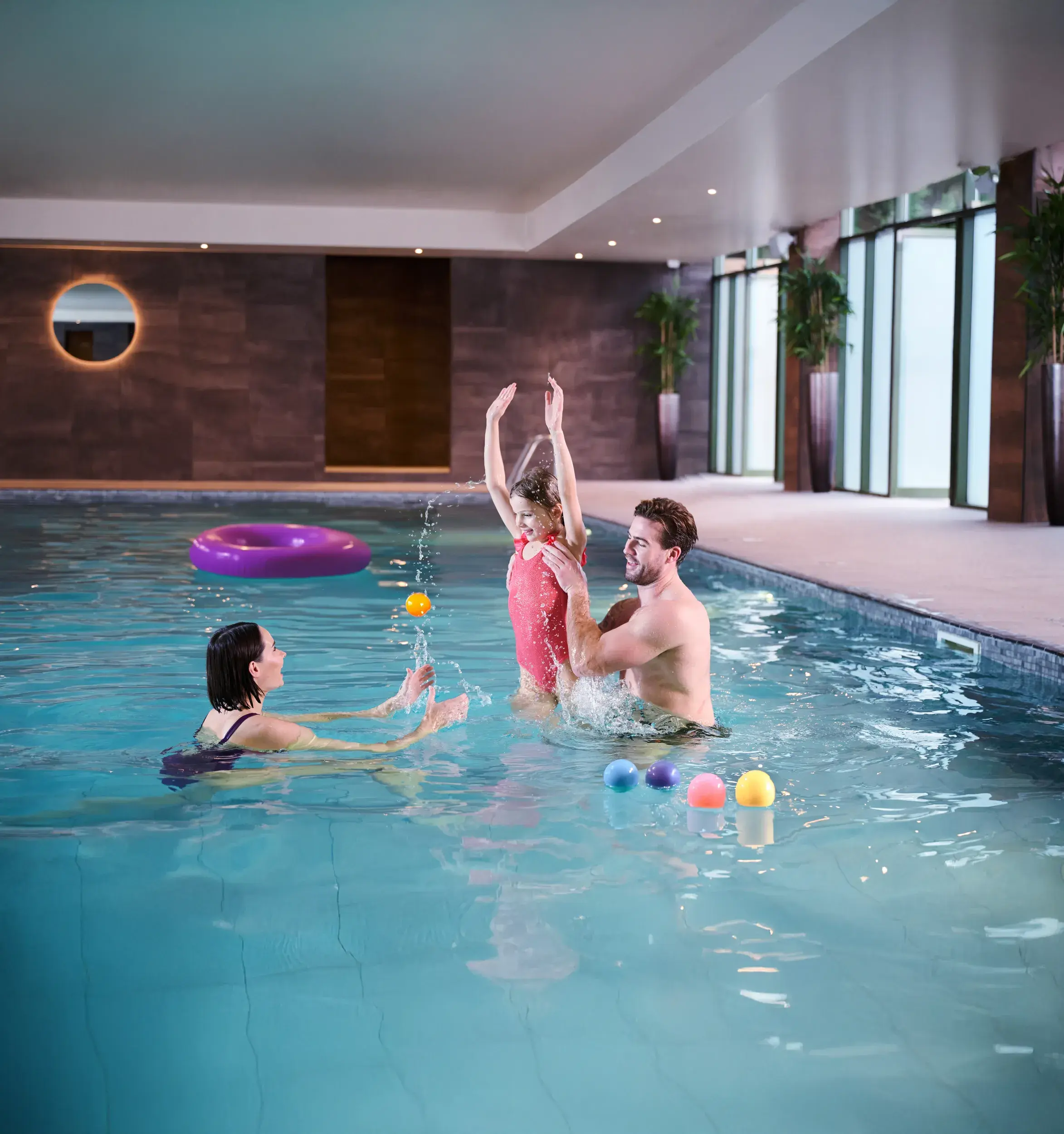 a family playing in th pool