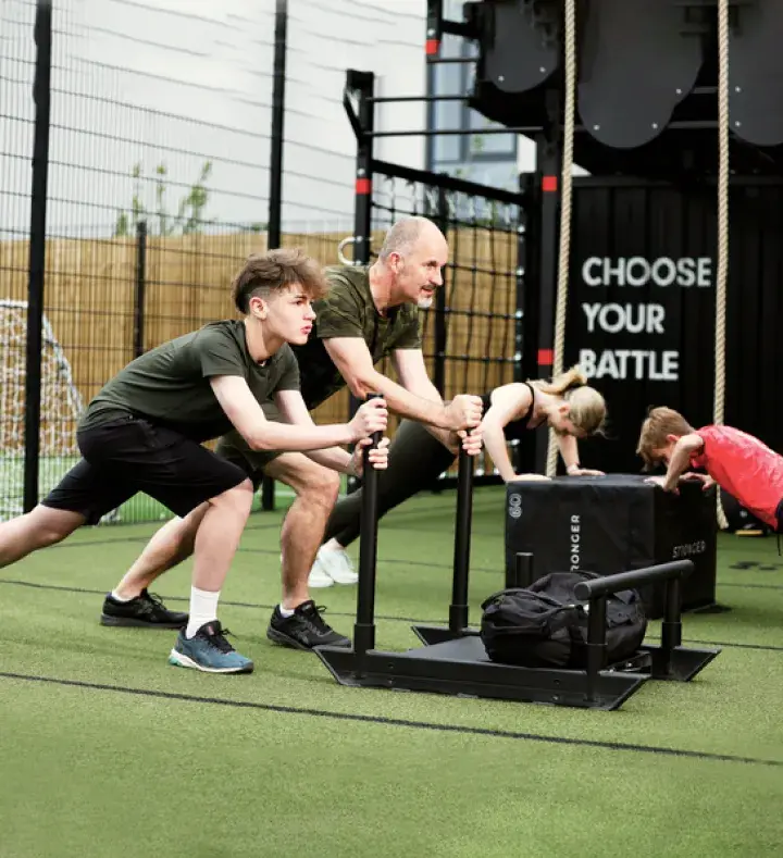 A young girl running on a treadmill in a Blaze Rebels class