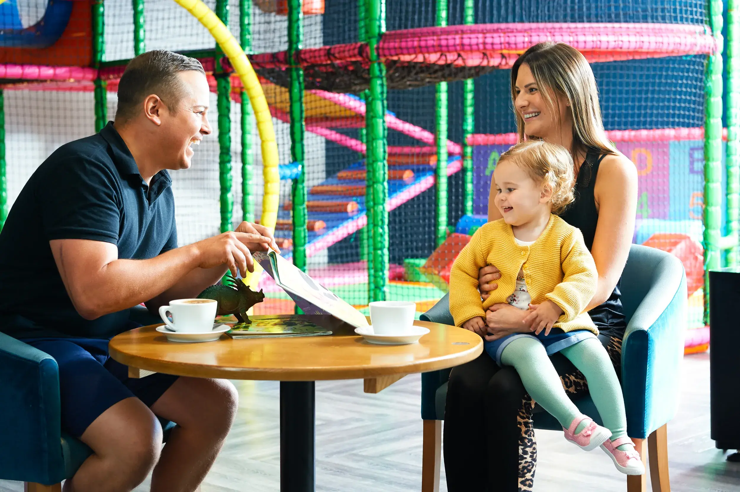 A family having coffee by soft play