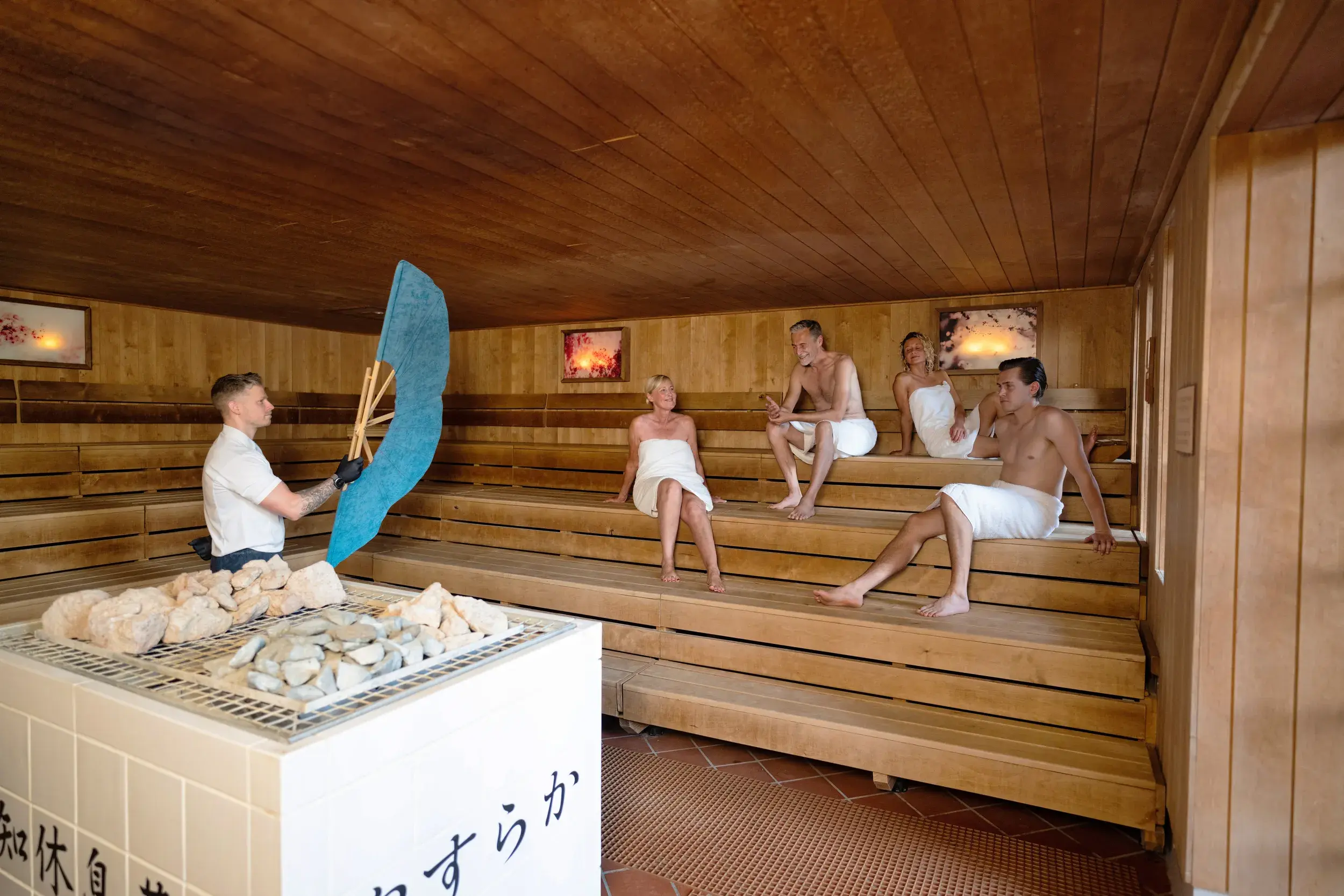 Group of people enjoying the sauna