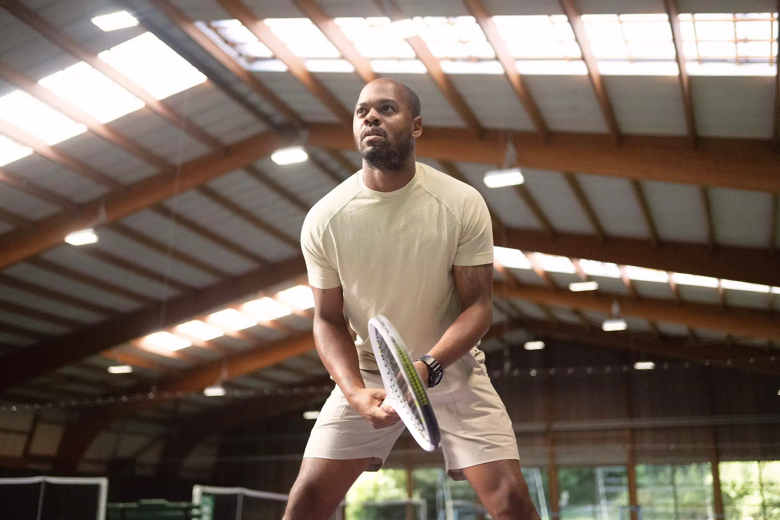 A woman playing tennis on an outdoor court