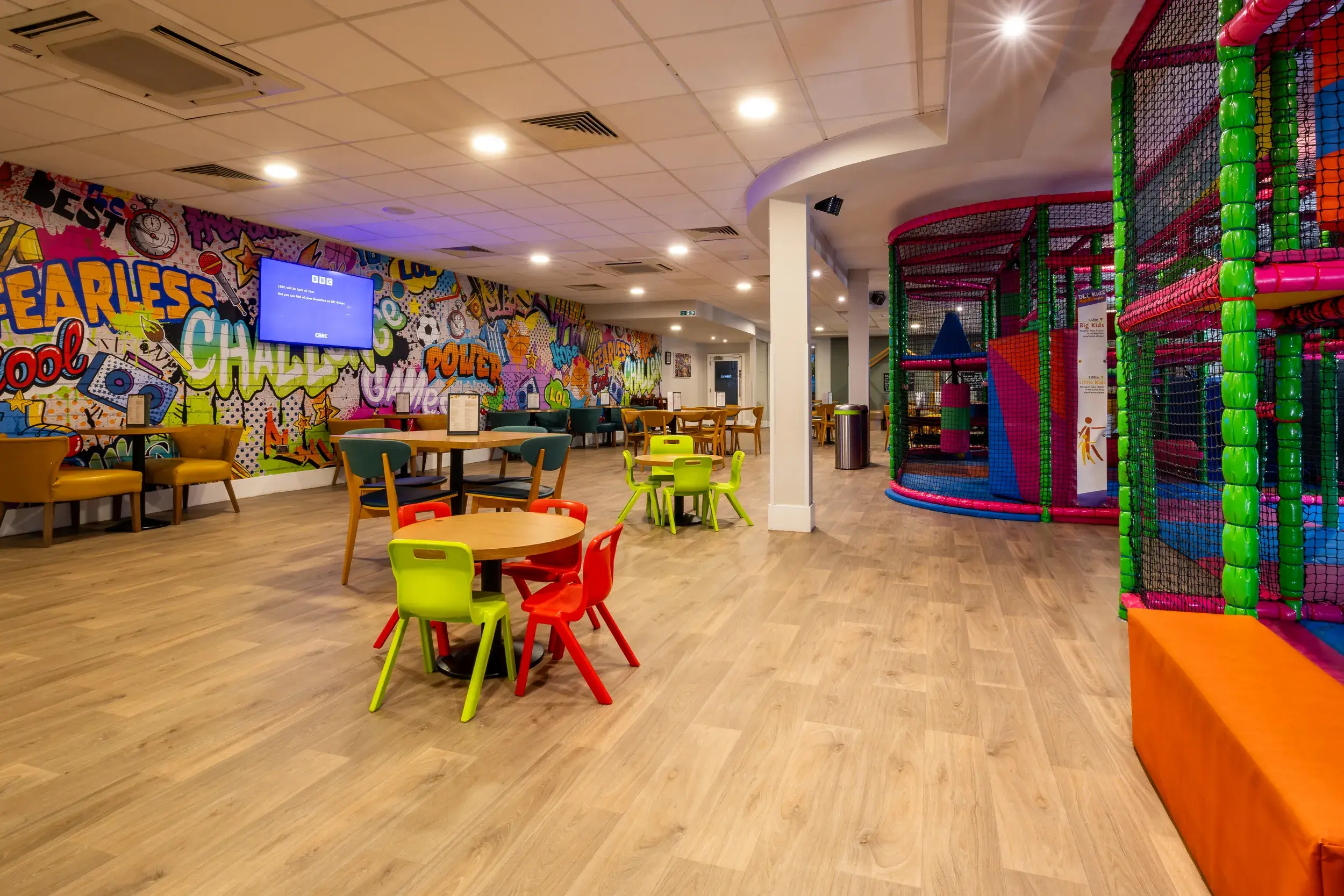 Children's area including a graffiti wall and soft play 