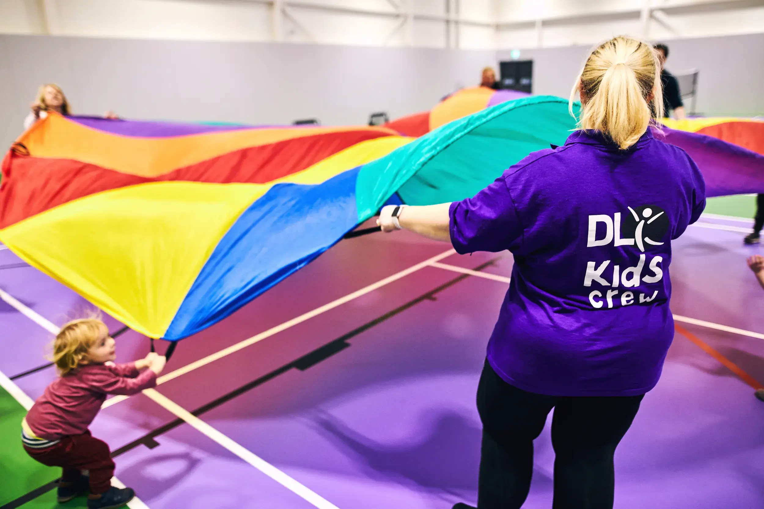 Holiday club - playing with a parachute
