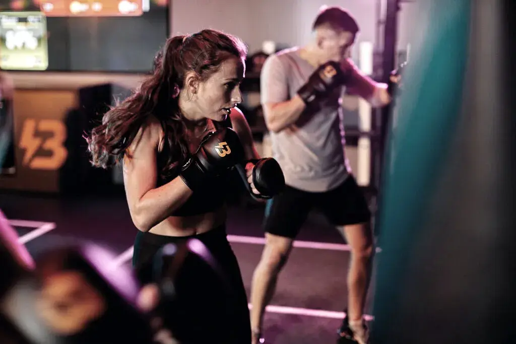 2 people punching punch bags