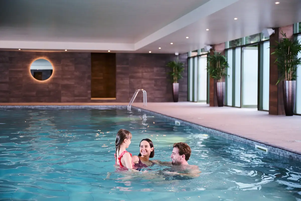 A family in the swimming pool