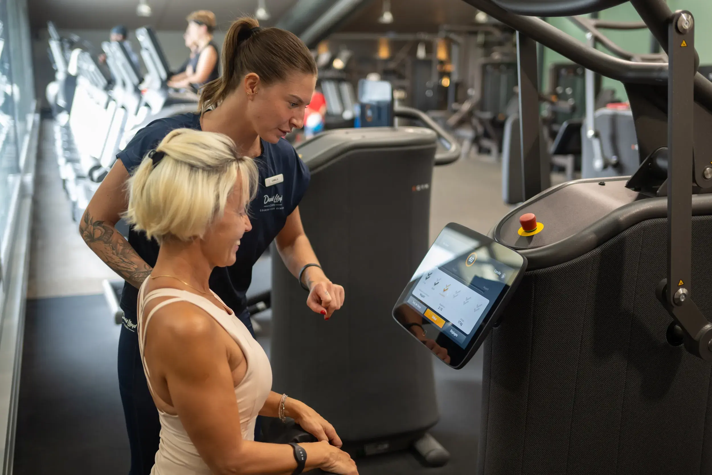 PTs and members of all ages engaged in a variety of training at the club gym