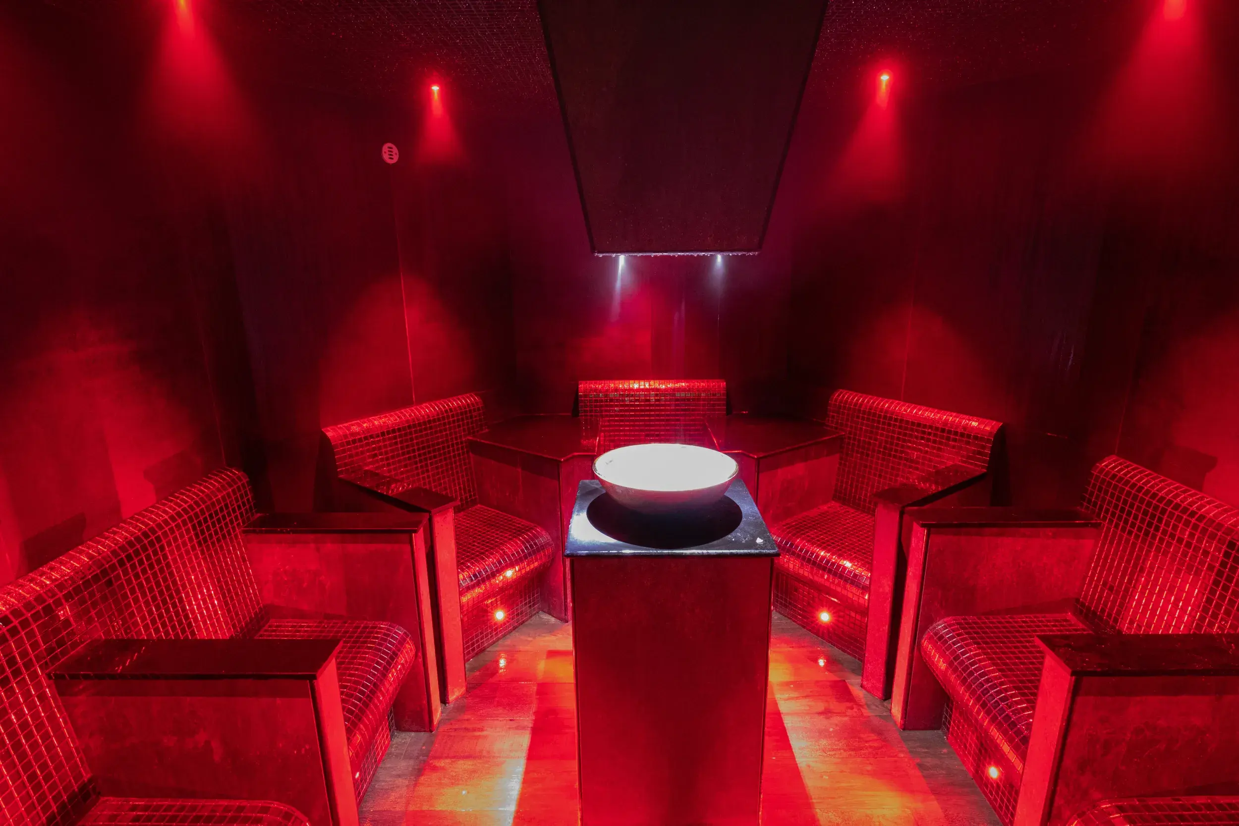 Fire and Ice experience room, with ice in a bowl in the centre of the room with seats surrounding it.