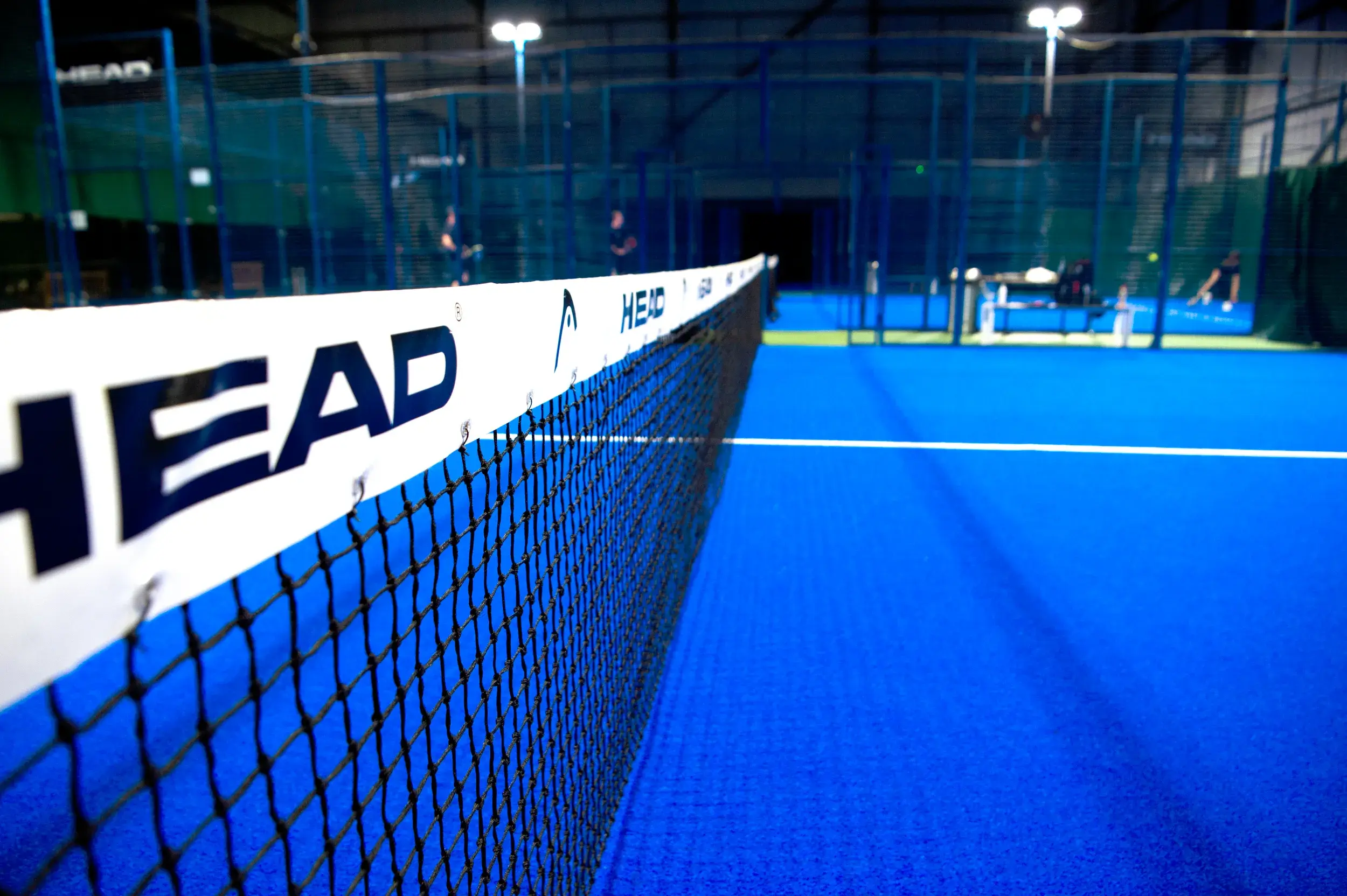 4 people playing a game of Padel