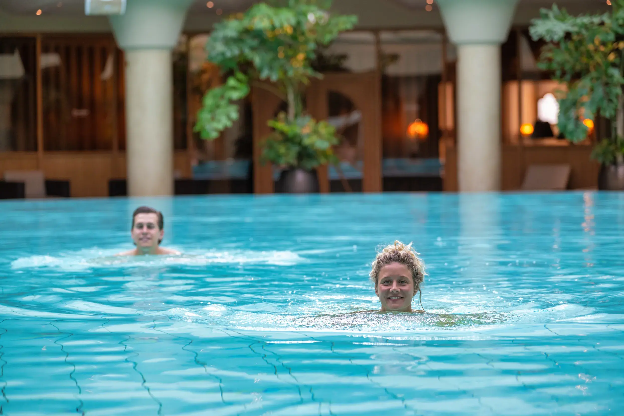 A couple enjoying the indoor pool