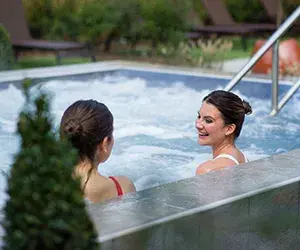 Two women in the outdoor hydro pool
