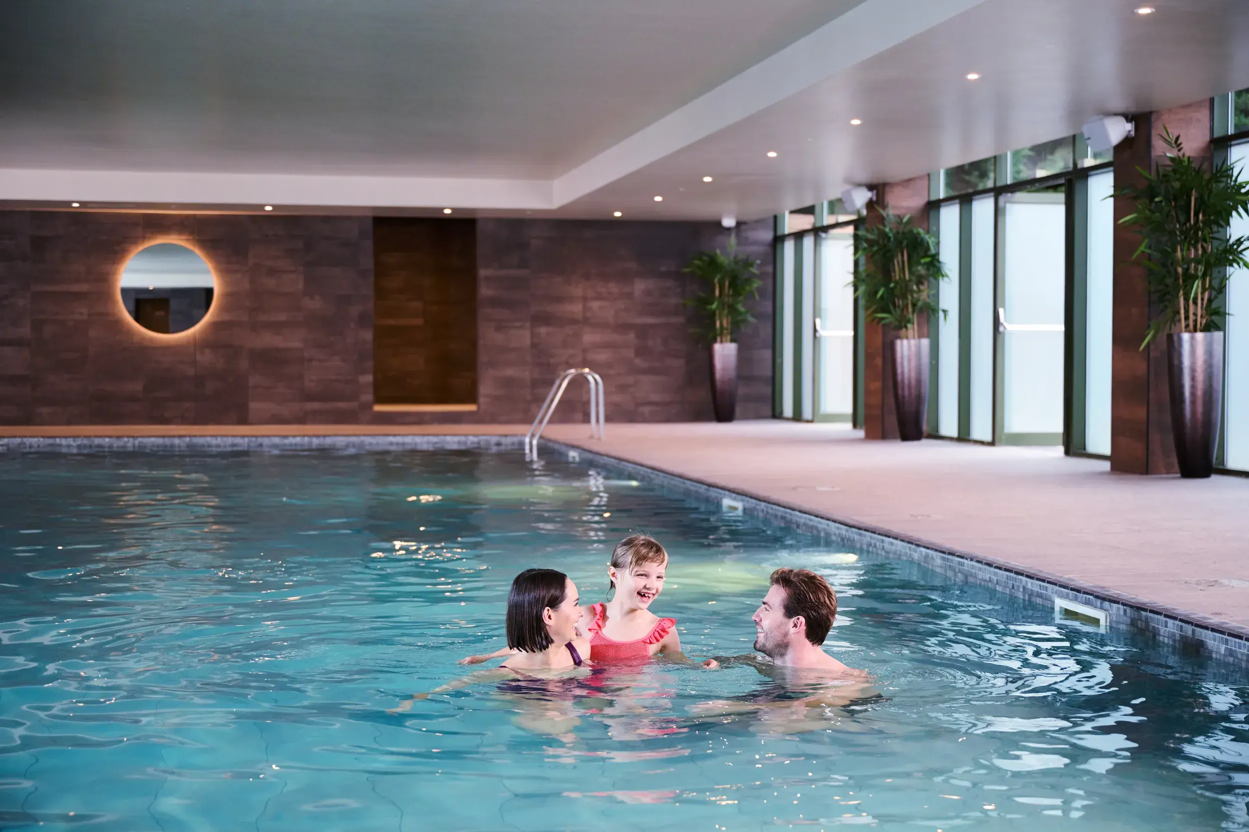 A family enjoying the pool