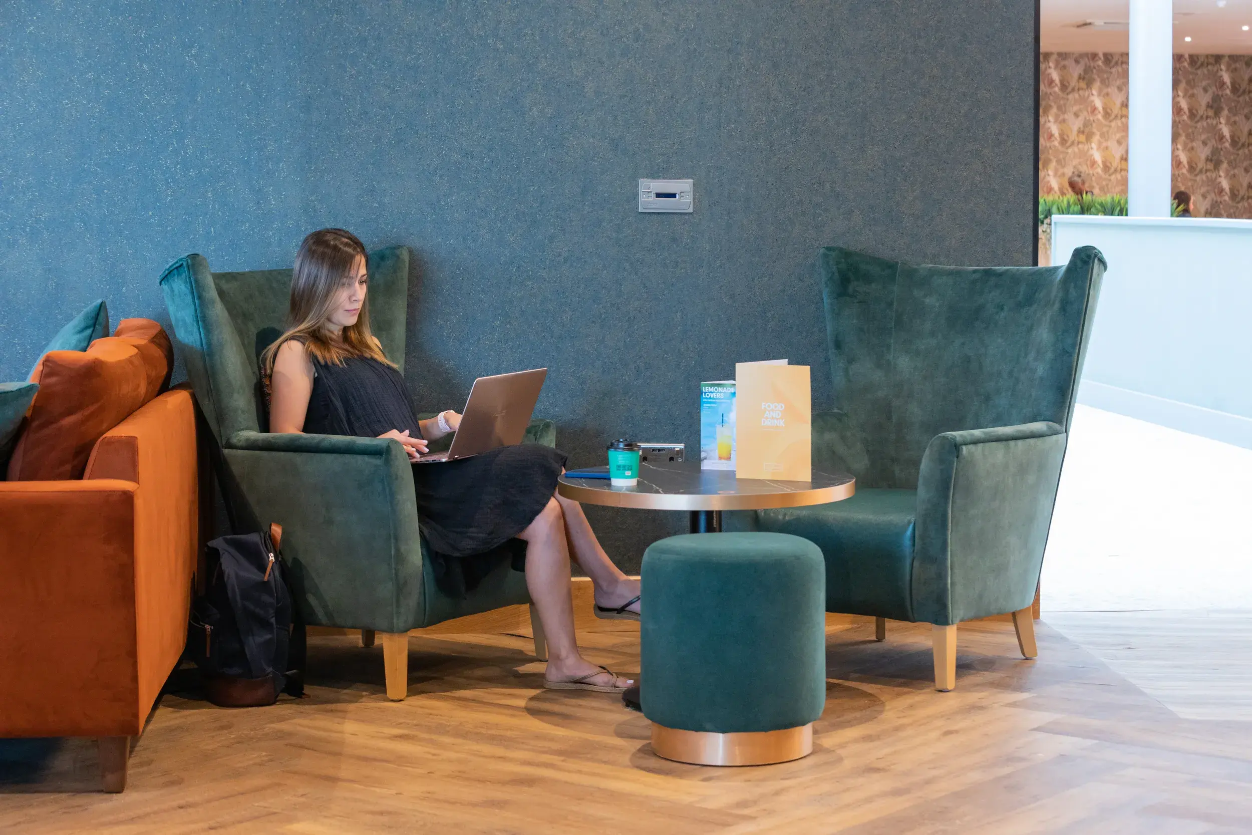 A woman working on a laptop at David Lloyd Cricklewood Lane